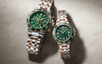 pair of mens and womens Gc watches with green dials