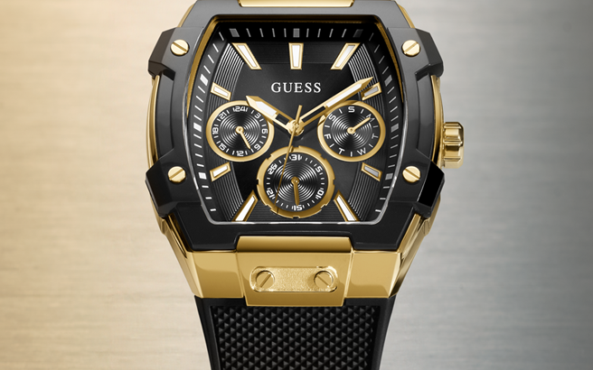 Gold and black watch with visible brand name on a gradient background