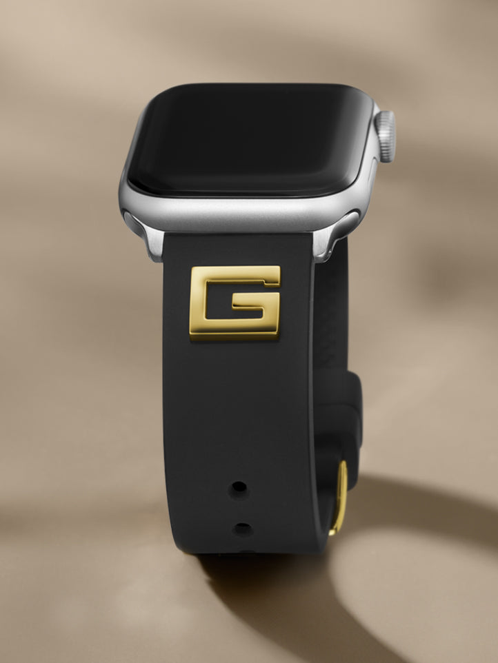 Apple Watch band in black silicone with a gold G logo