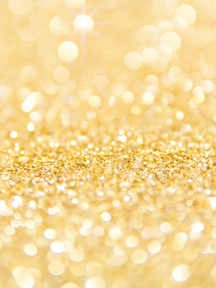 Gold glittery background with bokeh lights