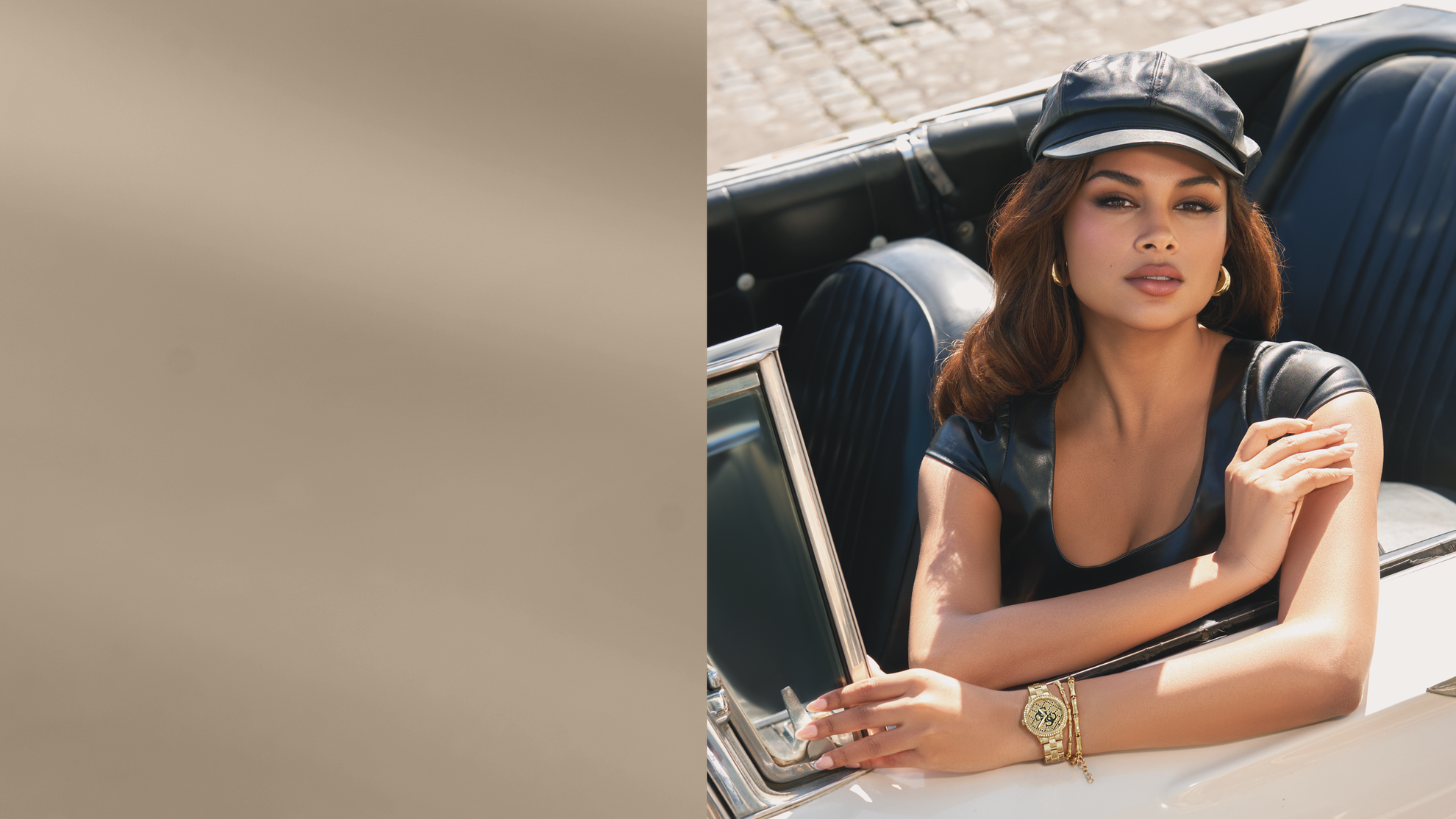woman sitting in a car wearing a gold guess logo watch