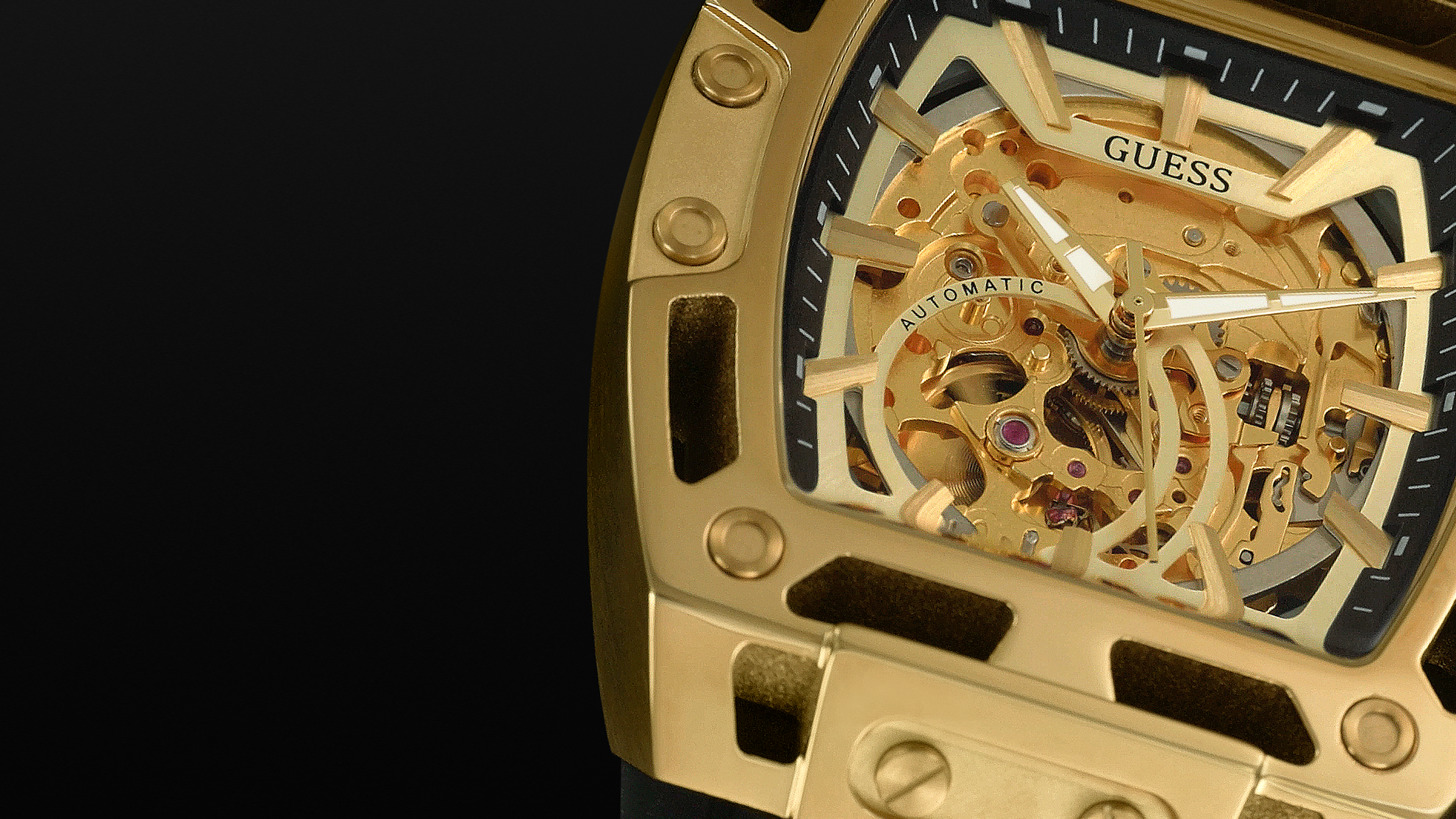 close up of mens GUESS automatic watch in black and gold