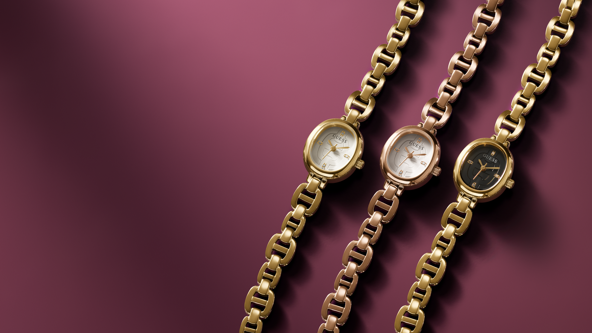 Three gold chain watches on a maroon background