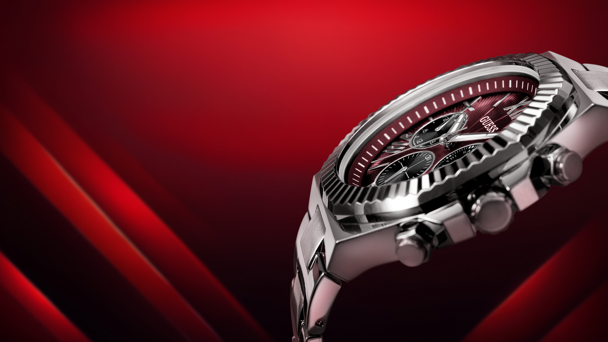 Angled view of a Silver watch with red accents on a red background