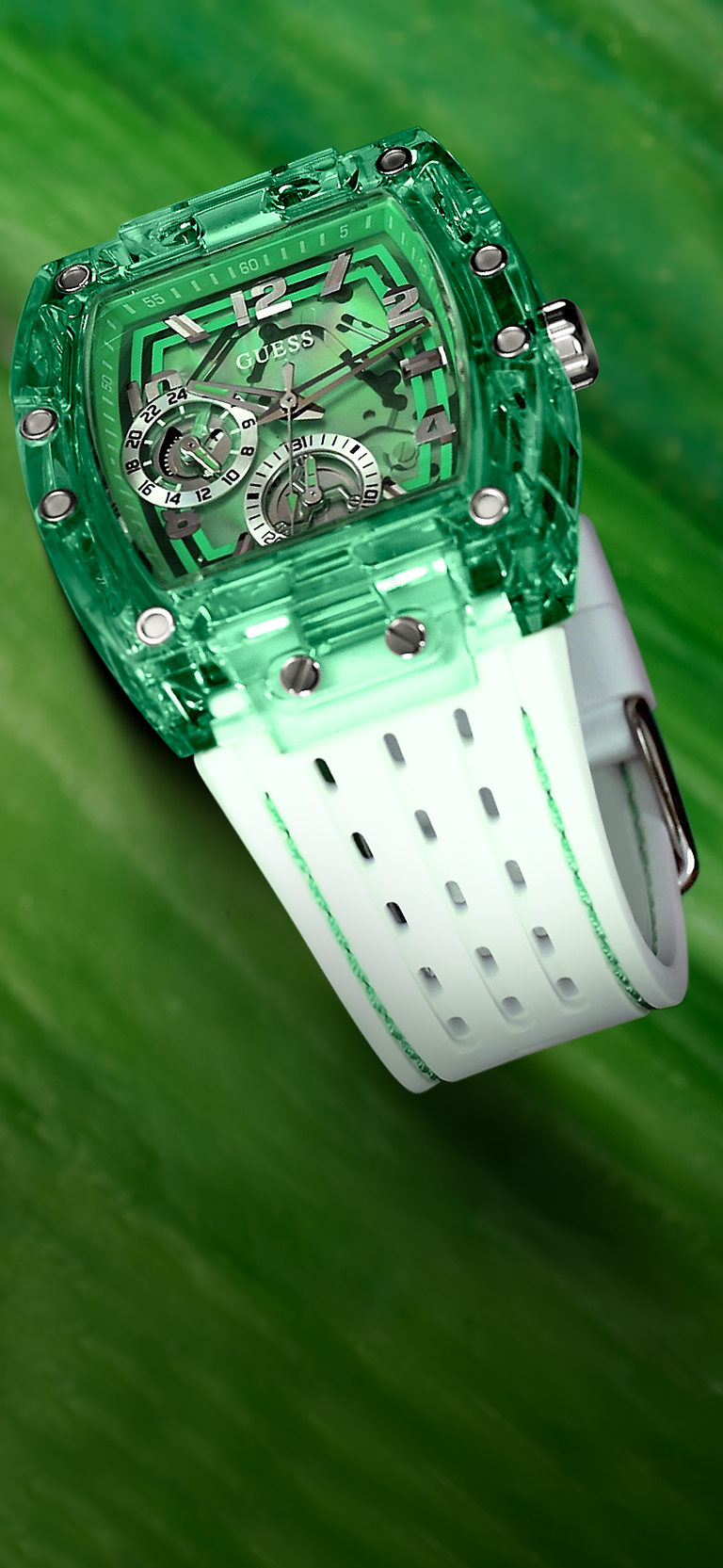 Green transparent watch with white strap on a green background