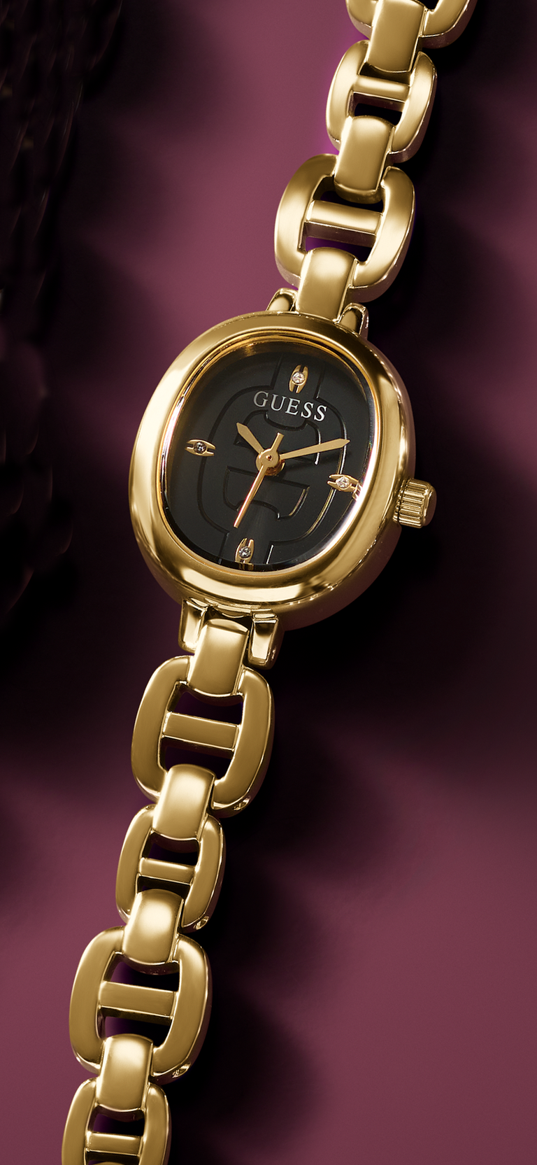 Gold watch with a black dial on a purple background GW0982L2