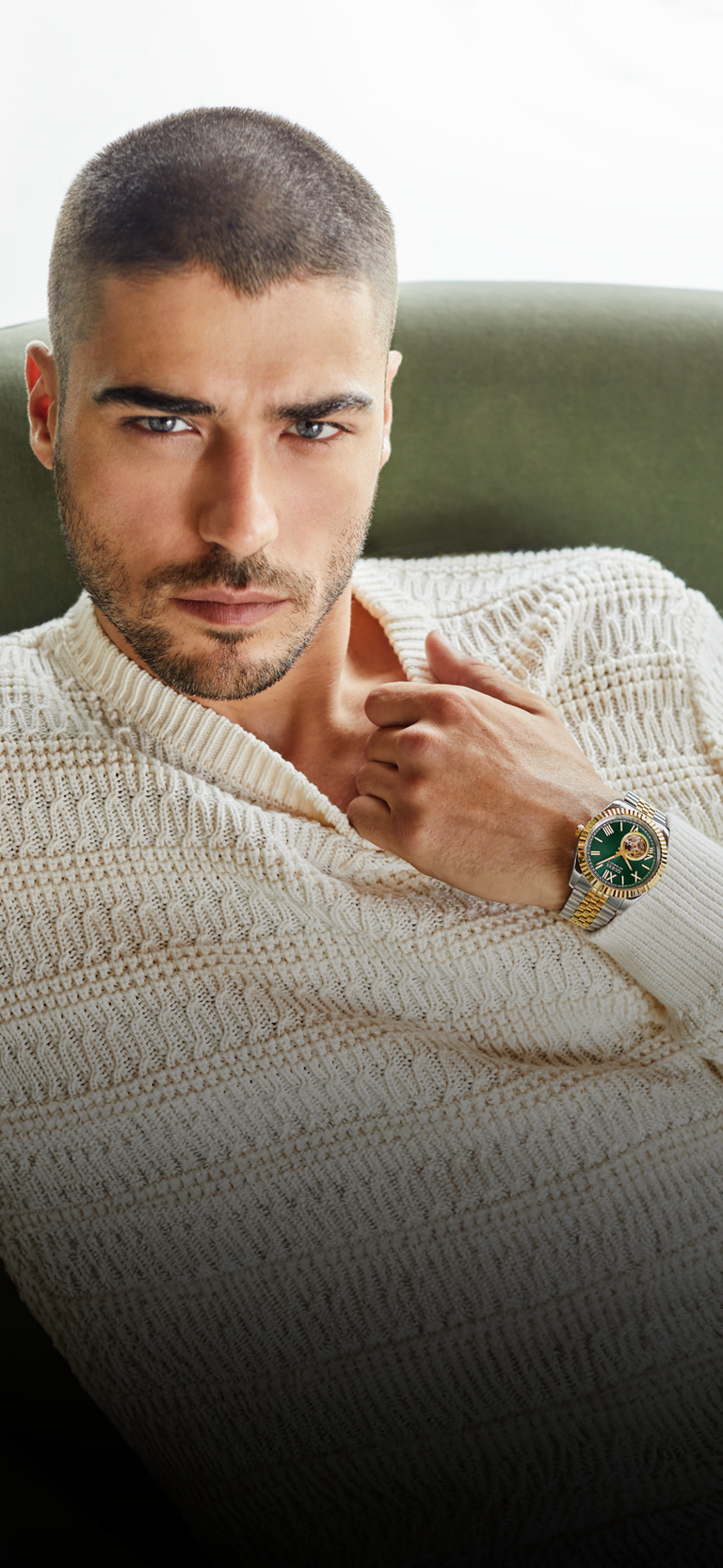 man wearing two tone automatic watch with green dial