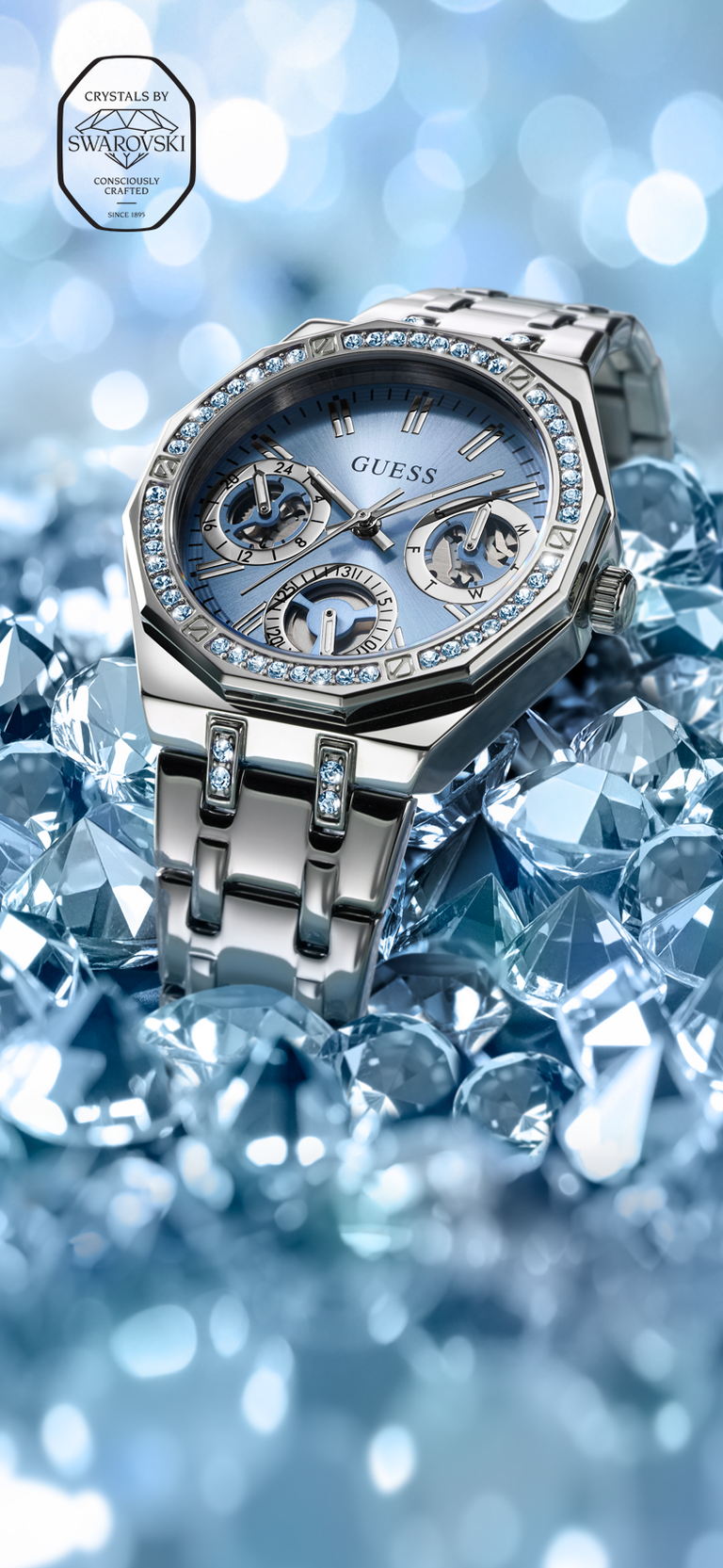 GW1009L1 silver watch with ice blue dial and swarovski seal in upper left