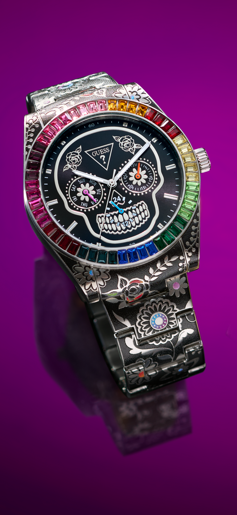 GW0962G1 watch with colorful gemstones on a purple background