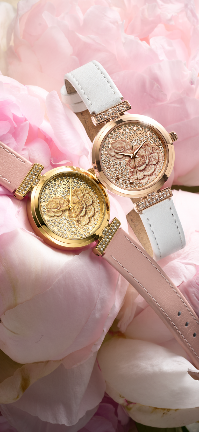 Two elegant watches with floral designs on a pink floral background