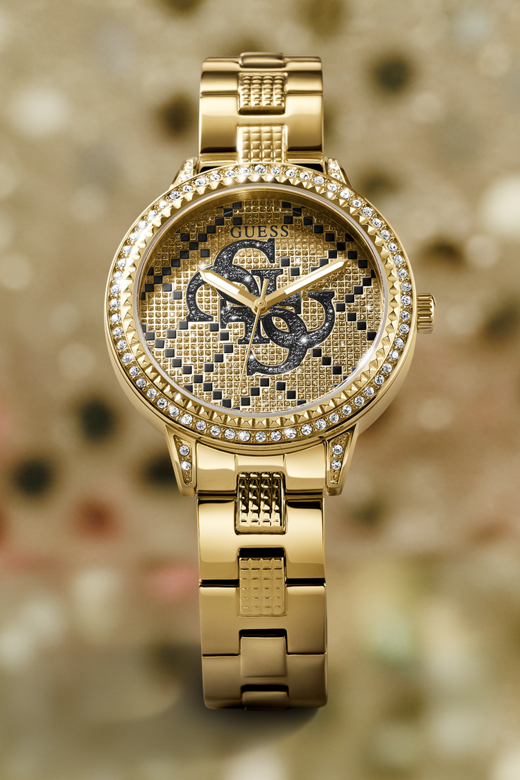 Gold watch with a brand logo on a blurred background