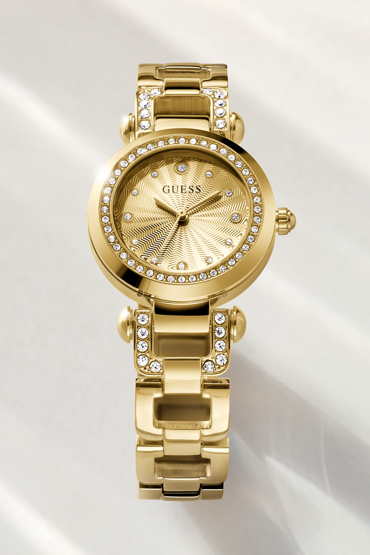 Gold watch with gemstone accents on a white background