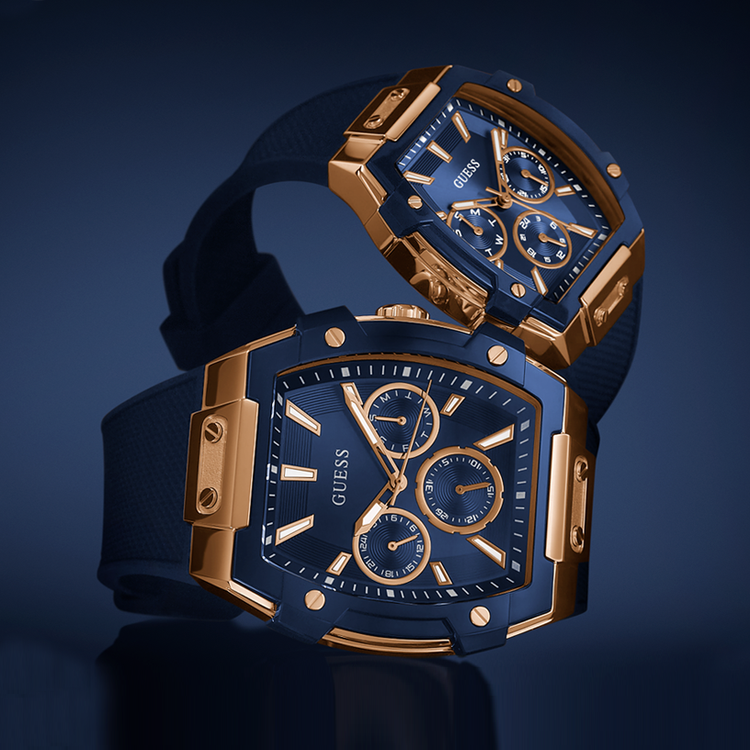 Blue and gold Guess watch on a dark blue background