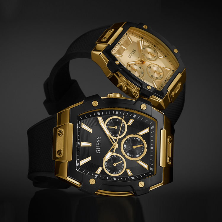 His and Hers Gold and black Guess watch on a dark background