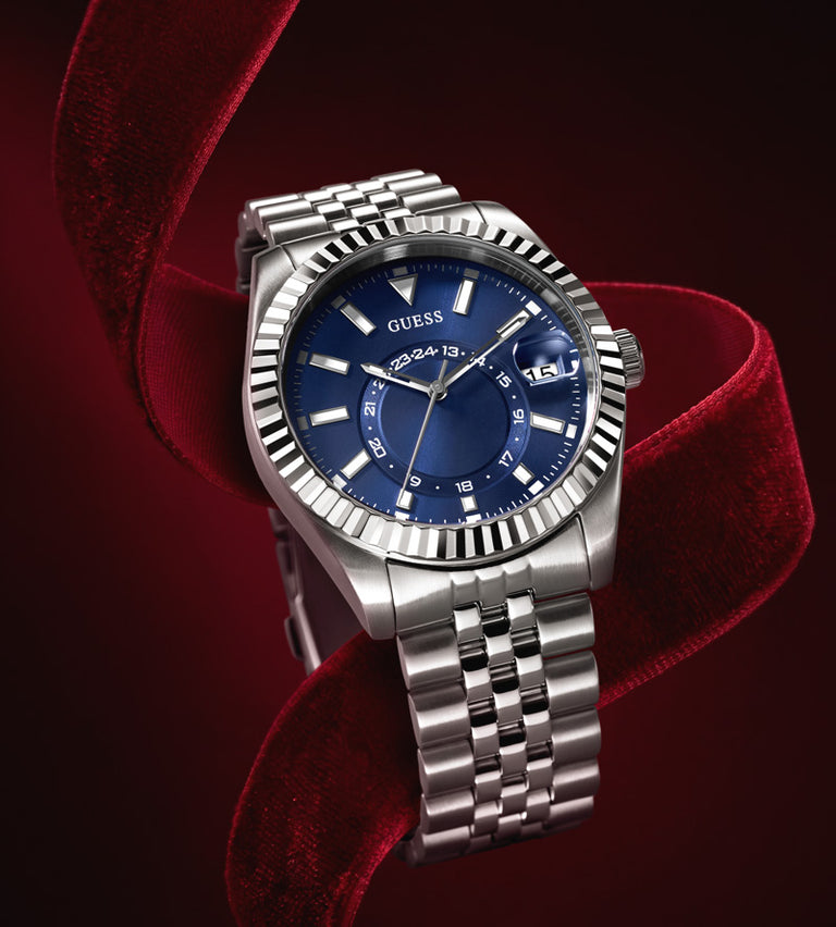 mens silver watch with blue dial on a red ribbon background