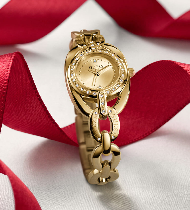 womans gold watch on red ribbon background