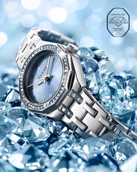Womens silver watch with blue dial and Swarovski crystals with logo in upper right