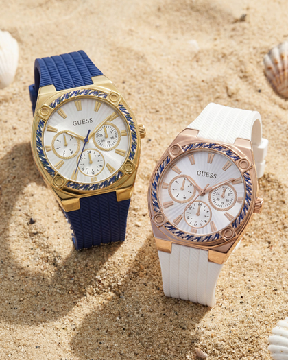 two womens silcone watches on a beach