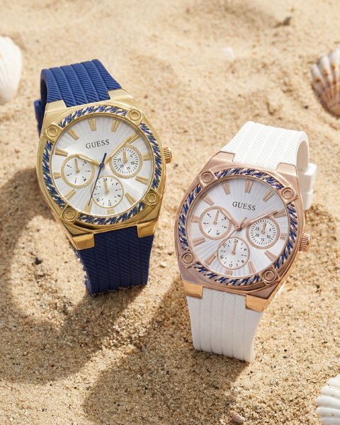 two womens silcone watches on a beach