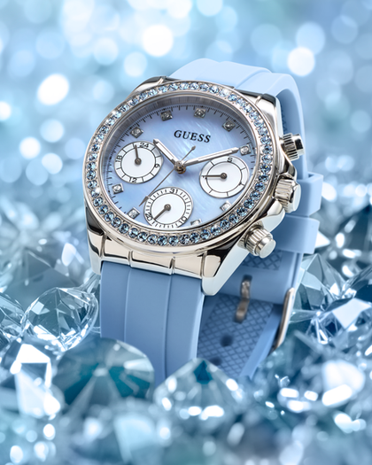 Blue Guess watch with gemstone accents on a blue gemstone background