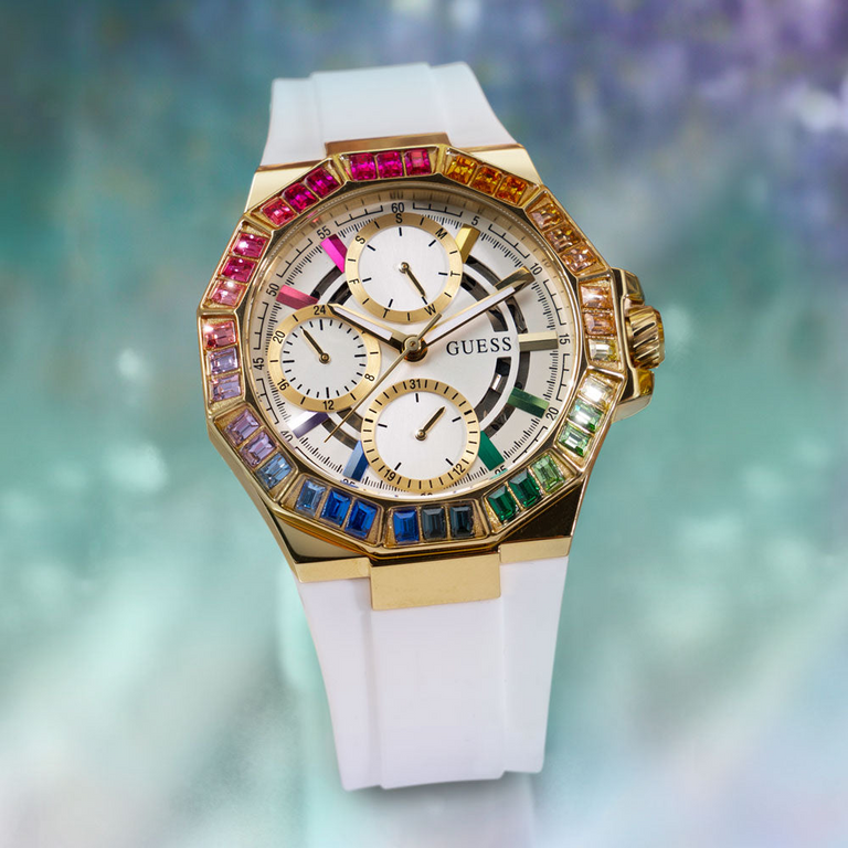 white watch with rainbow crystals on bezel