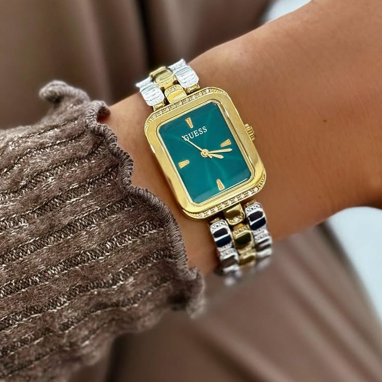 wrist wearing ladies watch with green dial