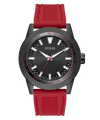 Watch with black dial and red strap on a white background