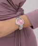 Z12010L9 Pink watch with silver bracelet on a wrist, wearing a mauve dress.