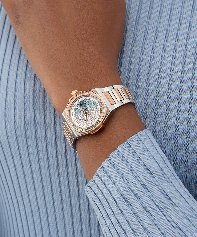 Gc Coussin Shape Mini Small Size Metal watch on a wrist with a light blue ribbed sweater