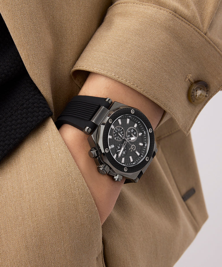 Person wearing a black Gc Legacy Chrono Silicone with a beige coat