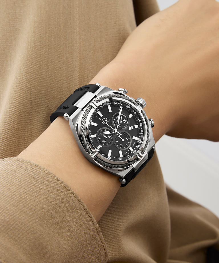 Gc IronClass Chrono Silicone watch with black strap on a wrist, wearing a beige shirt.