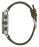 A side profile view of a watch with an olive green silicone strap, a silver-tone case, and matching olive green accents on the bezel, buttons, and clasp, set against a plain white background.