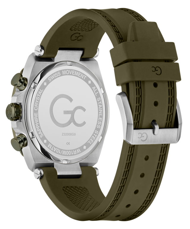 The back view of a GC brand watch with an olive green silicone strap and a silver stainless steel case, showing the engraved details on the case back and buckle.