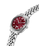 A women's stainless steel watch with a silver-tone link bracelet, featuring a round red dial with silver-tone Arabic numerals and a fluted bezel, shown on a plain white background. lifestyle