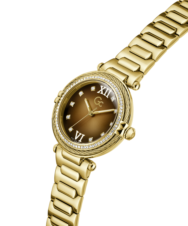 Gold Gc Vogue Cable Mid Size Metal watch with a brown dial on a white background lifestyle