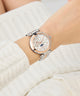 Gc TopChic Large Size Metal watch on a wrist with a white textured background