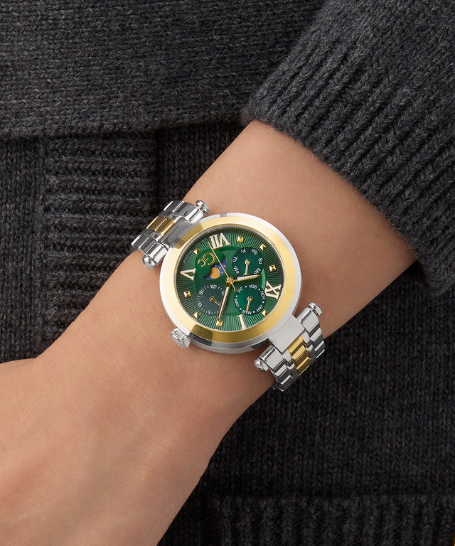 Gc TopChic Large Size Metal Green watch with gold accents on a wrist against a dark background