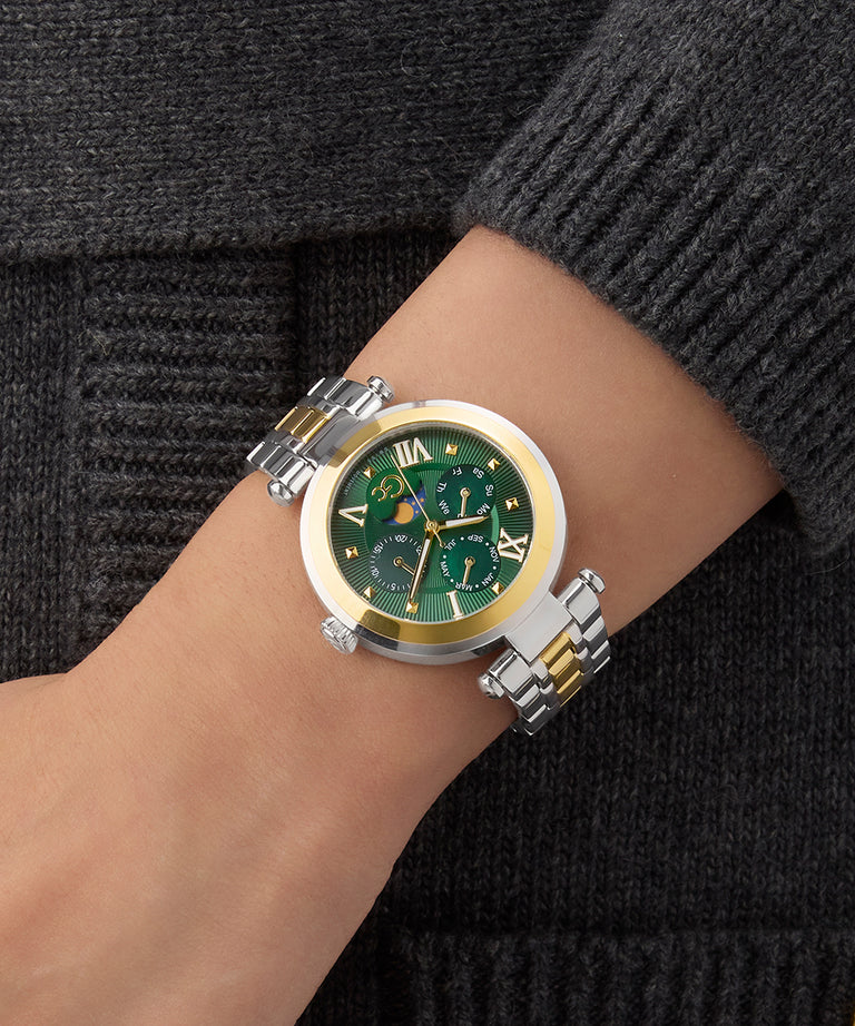 Gc TopChic Large Size Metal Green watch with gold accents on a wrist against a dark background