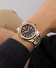 Gc Legacy Sleek Metal Rose gold watch on a wrist with a neutral background