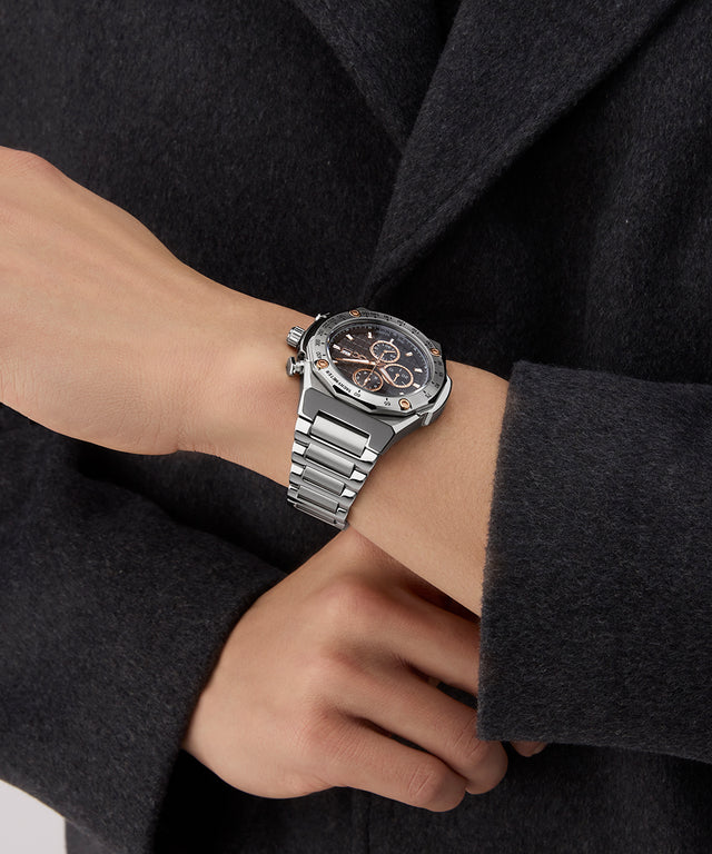Gc IdolSport Chrono Metal watch on a person's wrist with a dark coat