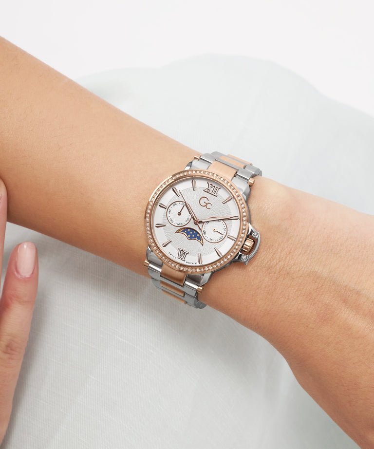 Silver and rose gold Gc MoonChic Large Size Metal on a wrist with a white background