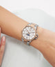 Silver and rose gold Gc MoonChic Large Size Metal on a wrist with a white background