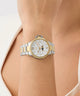 Gold and silver Gc MoonChic Large Size Metal on a wrist with a light background