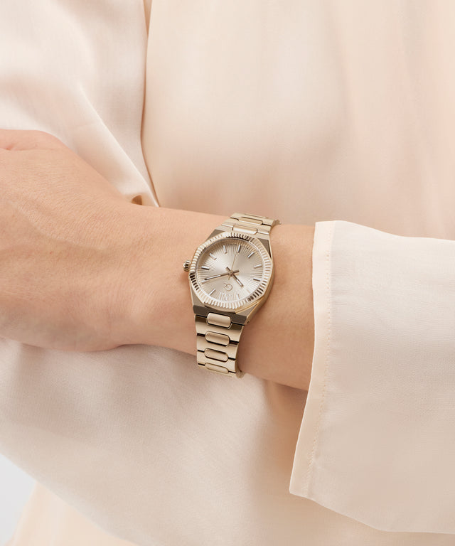 Gc Prodigy Lady Mini Small Size Metal watch on a wrist with a light background