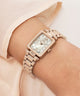 Rose gold Gc Plaza Mini Small Size Metal watch on a wrist with a light background