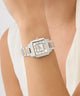 Silver Gc SquareCut Lady Mid Size Metal watch with rose gold accents on a wrist against a neutral background