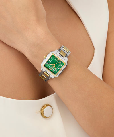 Green Gc SquareCut Lady Mid Size Metal watch with gold accents on a wrist against a neutral background