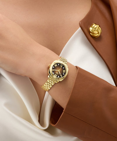 Gc Flair Coussin Mini Small Size Metal on a person's wrist with a brown jacket and white shirt