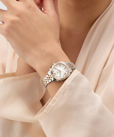 Gc Flair Coussin Mini Small Size Metal on a wrist with a beige blouse