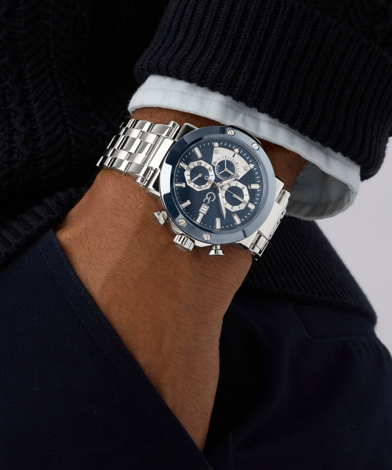 Close-up of a wrist wearing a silver Gc TechnoForce Chrono Metal watch with a dark face.